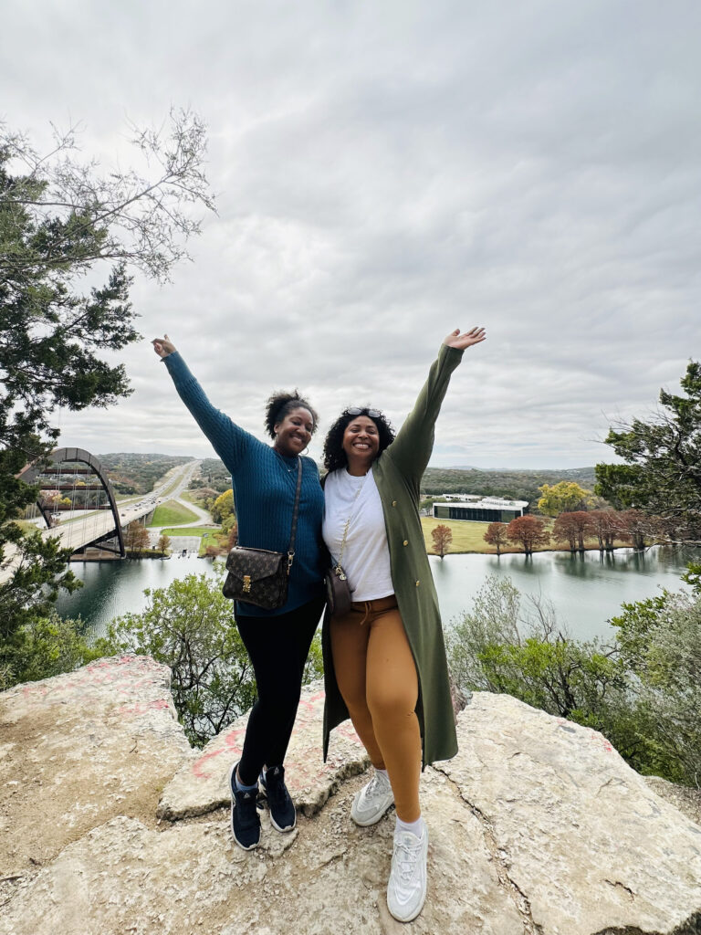Travelers posing on the cliff by the 360 Bridge in Austin, Texas